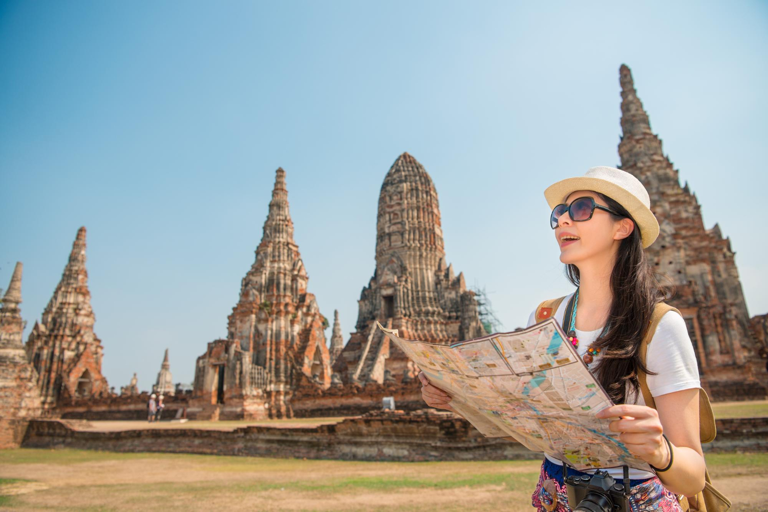 Asian tourist woman with local map.jpg